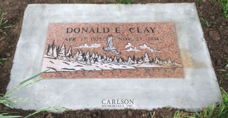 flat grave marker memorials in cederage for the Clay Family
