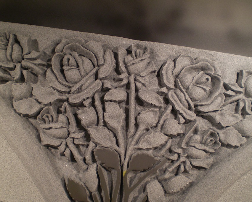 rose engraving in a headstone